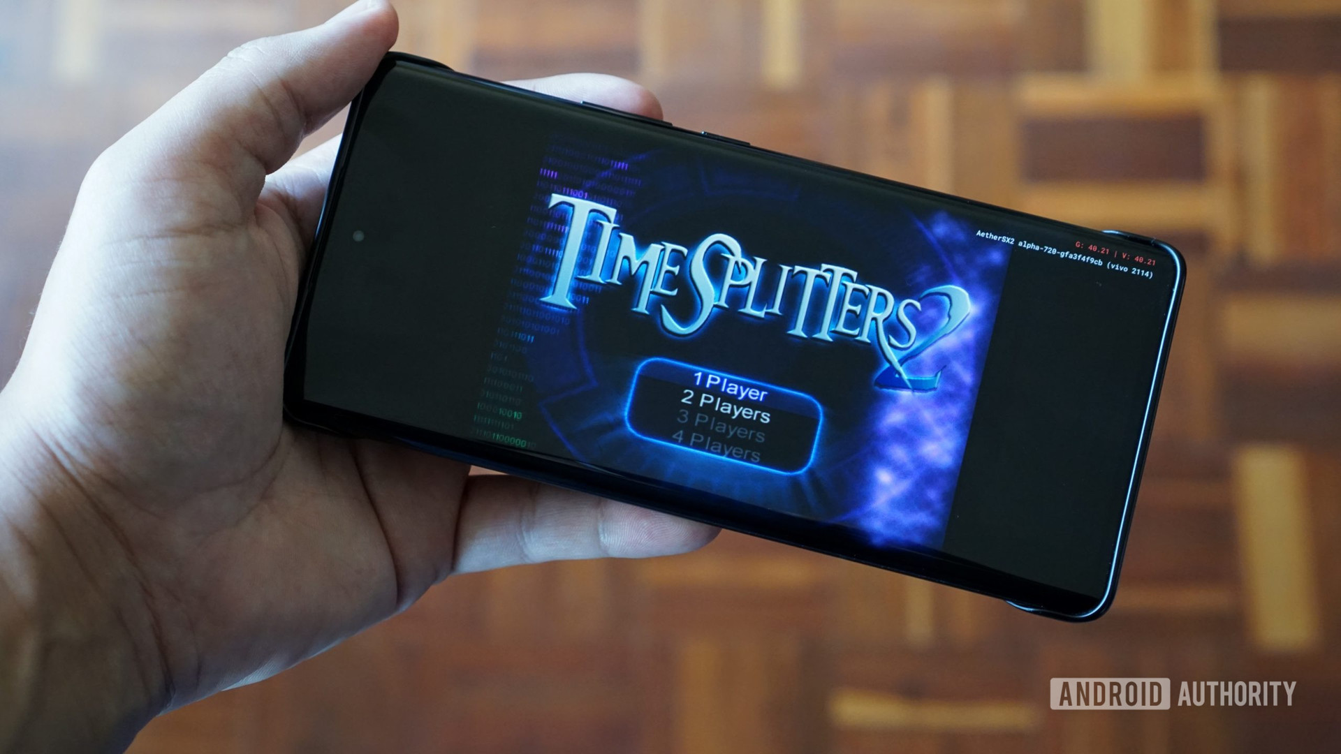 AetherSX2 emulator edit showing TimeSplitters game on a phone in hand