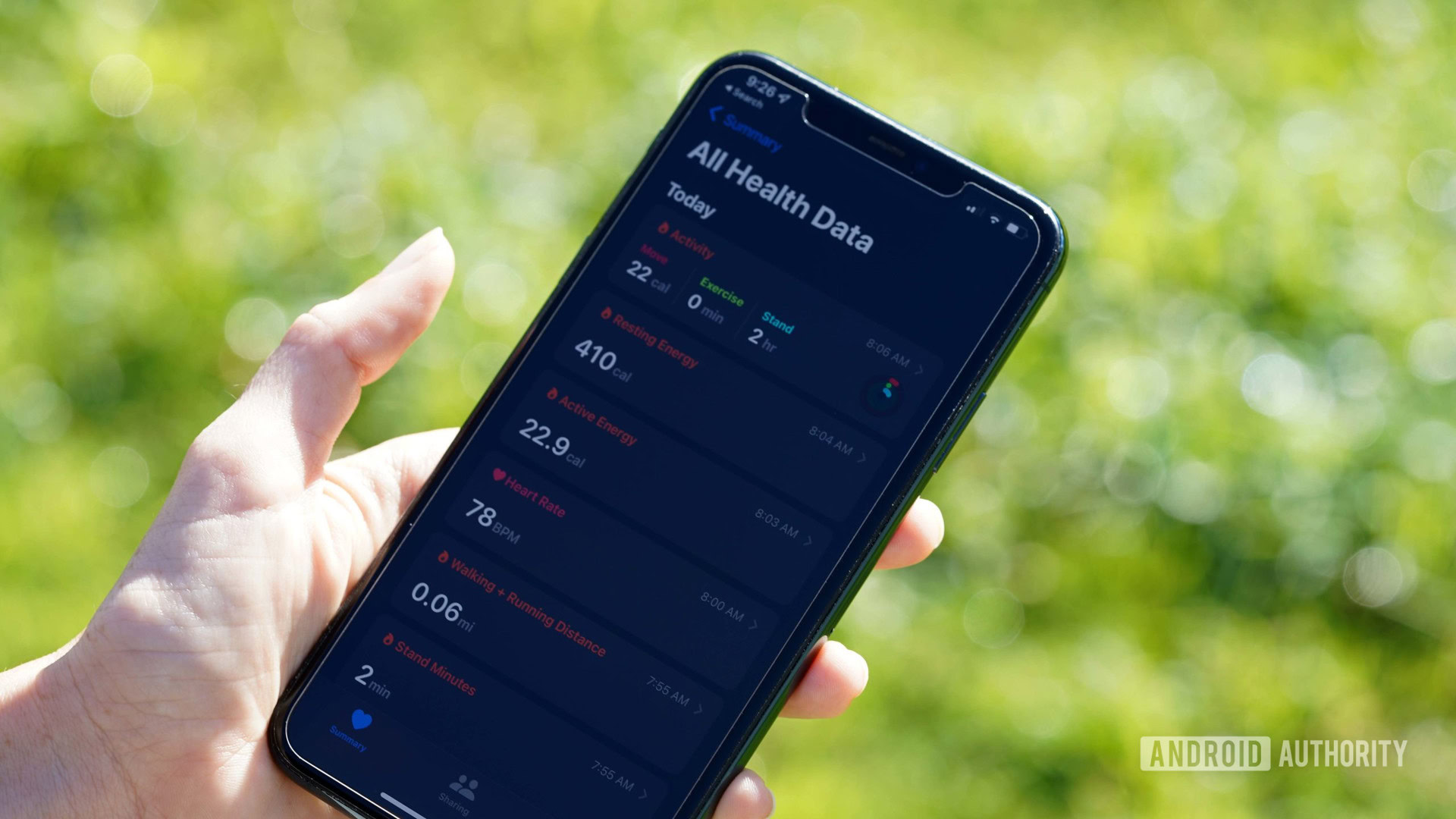 An Apple Watch user reviews their data in the Health app on their iPhone 11.