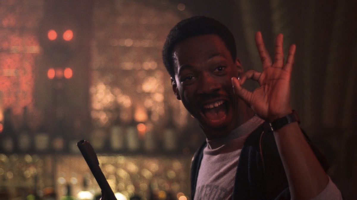 Eddie Murphy gives a good hand signal in Beverly Hills Cop - best movies leaving streaming services in February