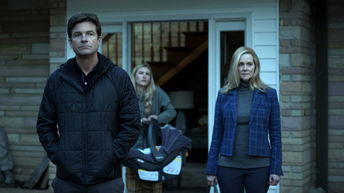 Still from Ozark season 4 part 1 on Netflix, featuring Marty, Wendy, and Charlotte outside the family home.