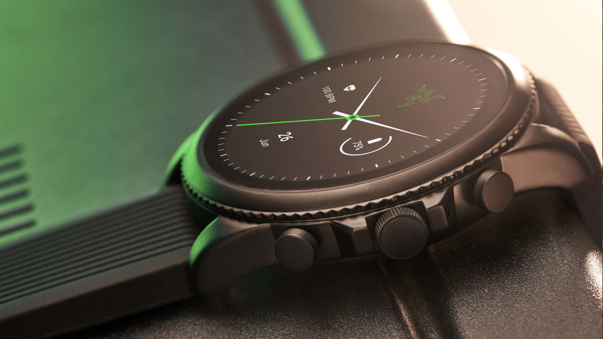 A beauty shot of the Razer X Fossil Gen 6 Smartwatch shows Razer's black and green aesthetic and the Razer logo on its watch face.