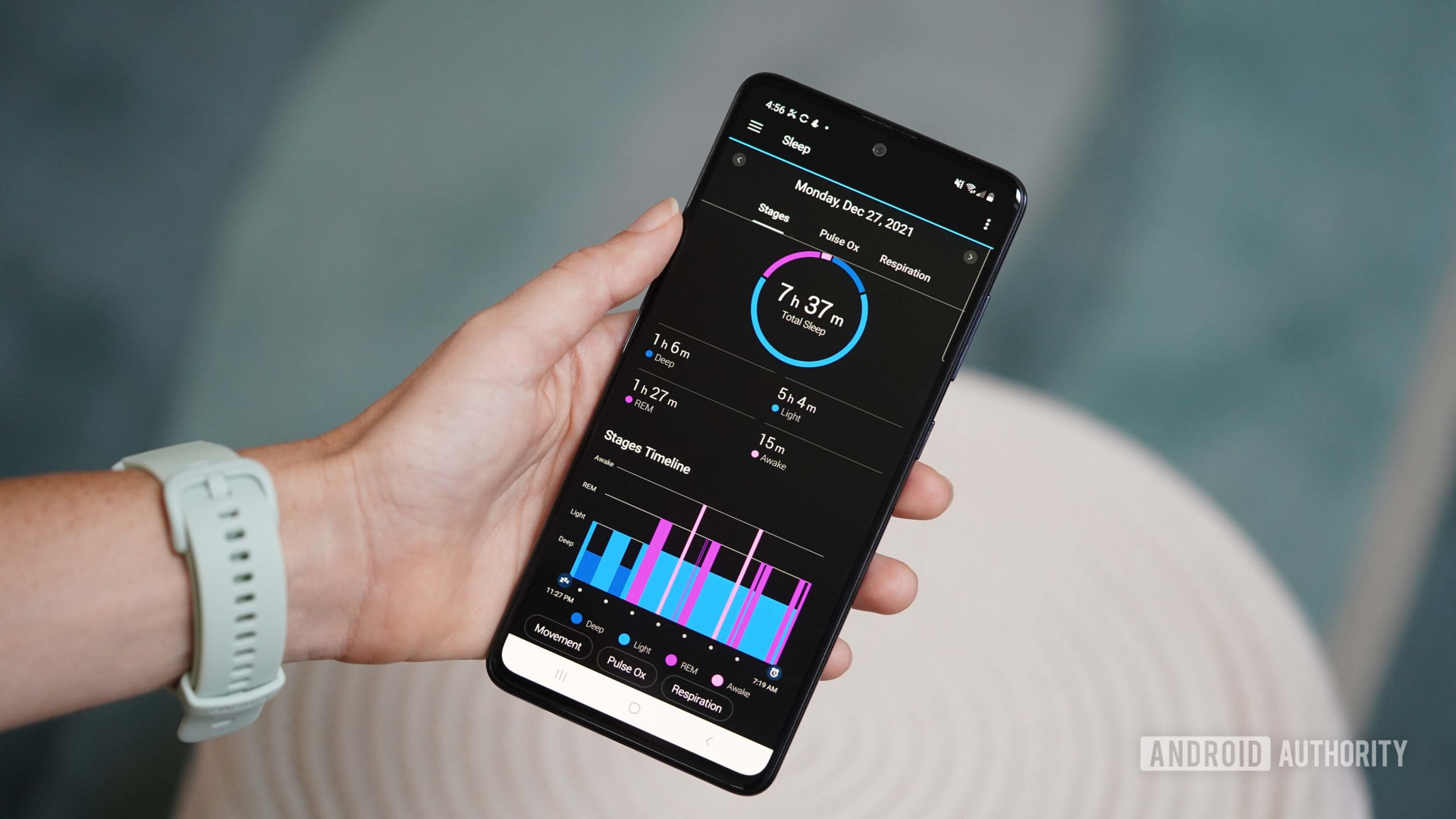 A Garmin watch user reviews her sleep data on a Samsung Galaxy A51. 