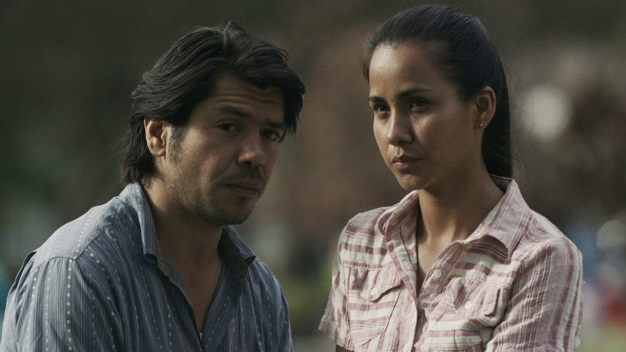 A man and woman stand together in The Last Hour - spanish language films on netflix