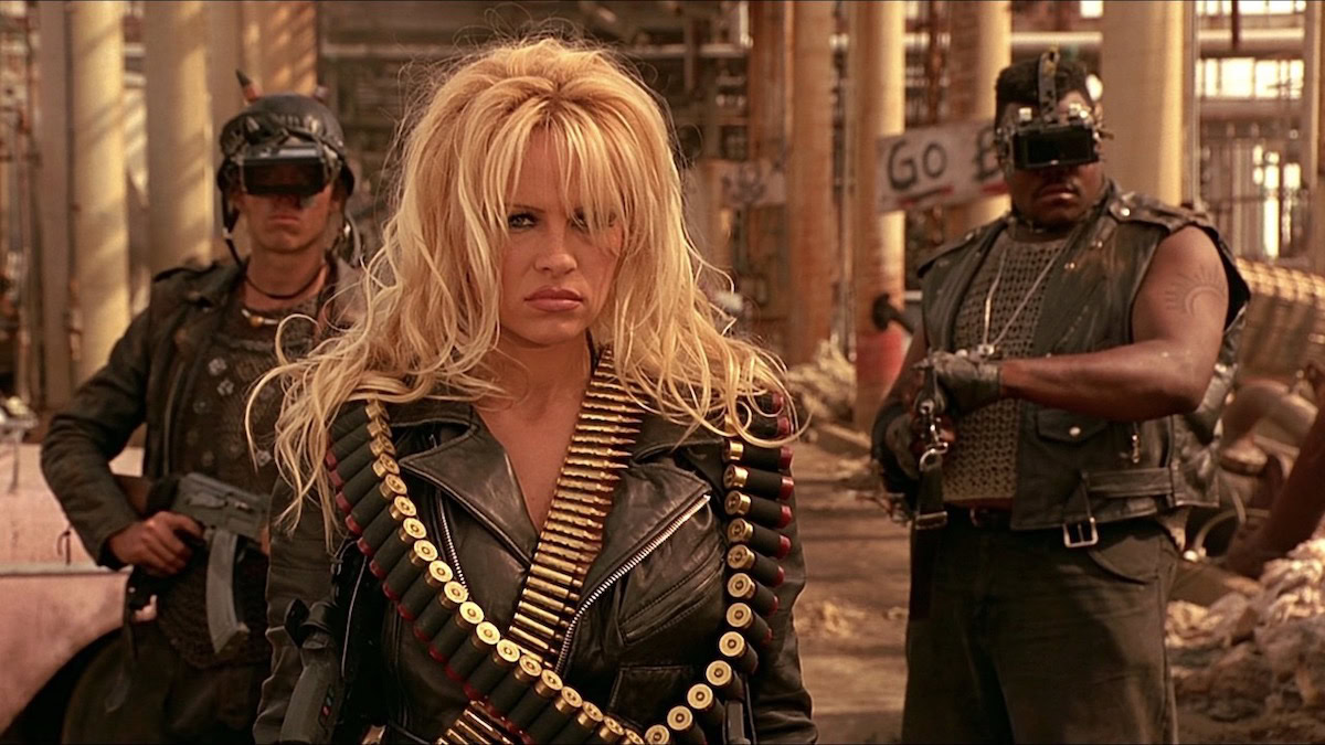 Pamla Anderson, armed and in leather in Barb Wire — movies like Pam and Tommy
