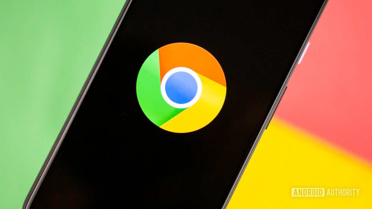 Smartphone showing Google logo on a green, red, and yellow background stock photo