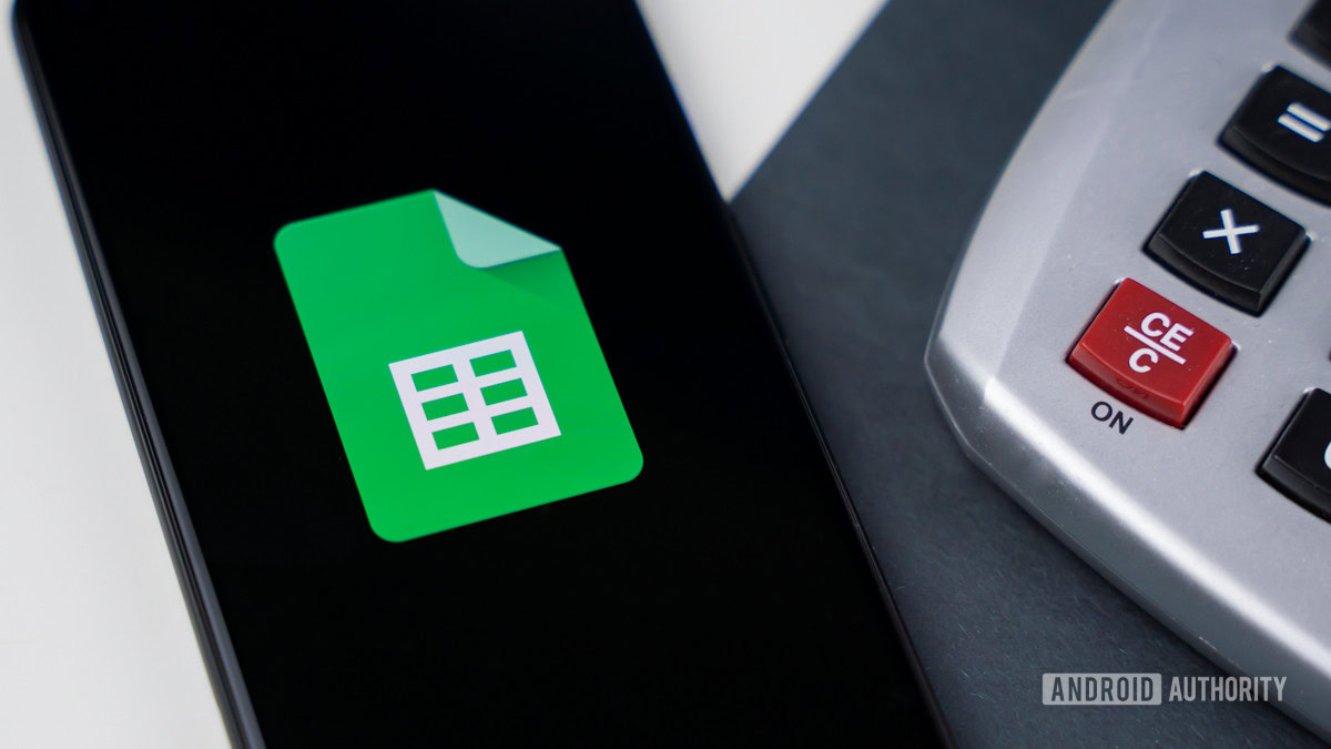 Google Sheets next to calculator stock photo 3