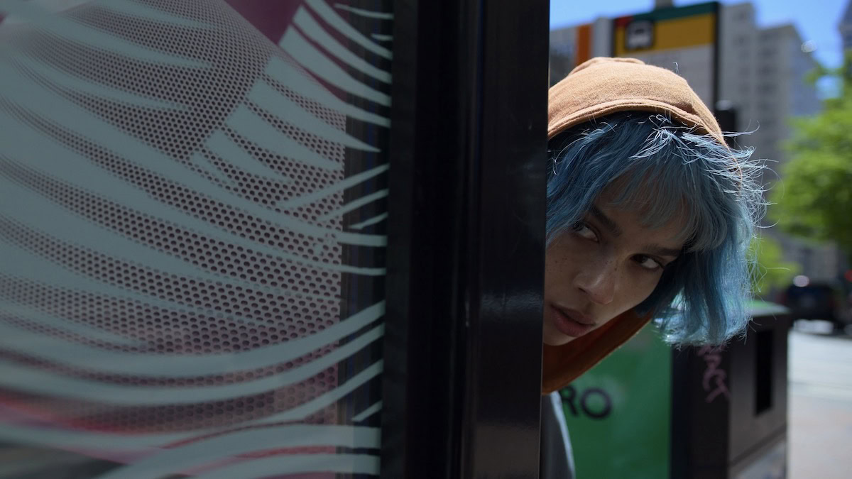 Zoe Kravitz peaks around a door in Kimi - best new streaming movies