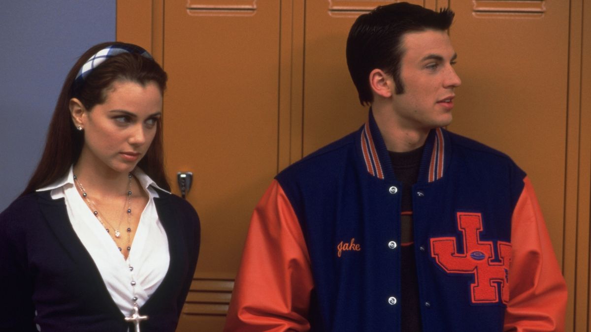 Mia Kirshner and Chris Evans in a high school hallway in Not Another Teen Movie - best funny movies on Netflix