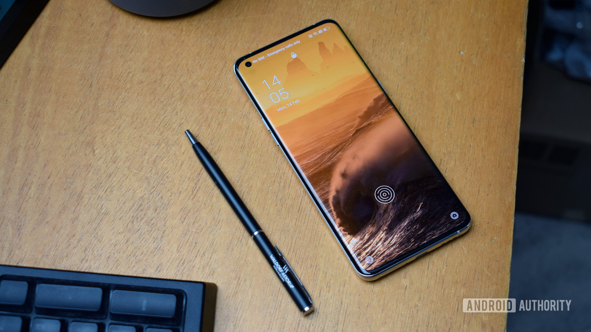 Oppo Find X5 Pro laying on wooden desk front