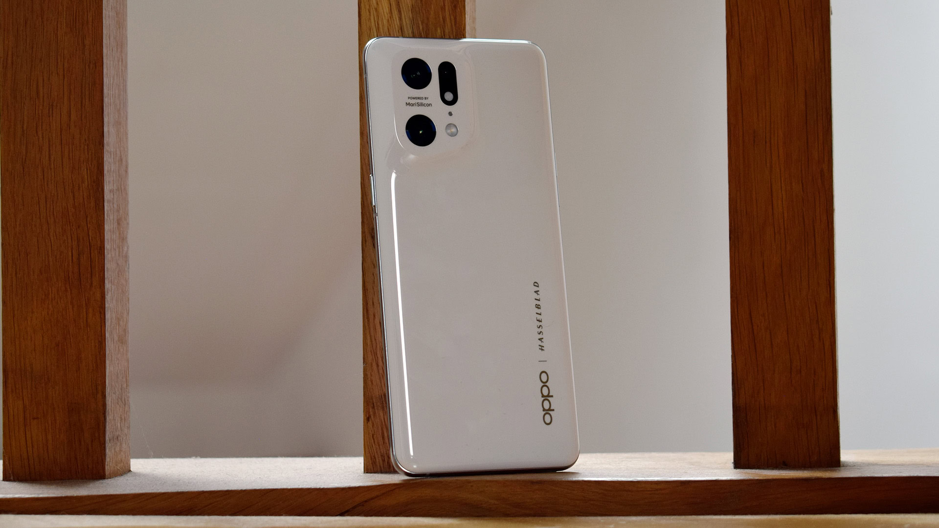 OPPO Find X5 Pro standing on wooden back drop