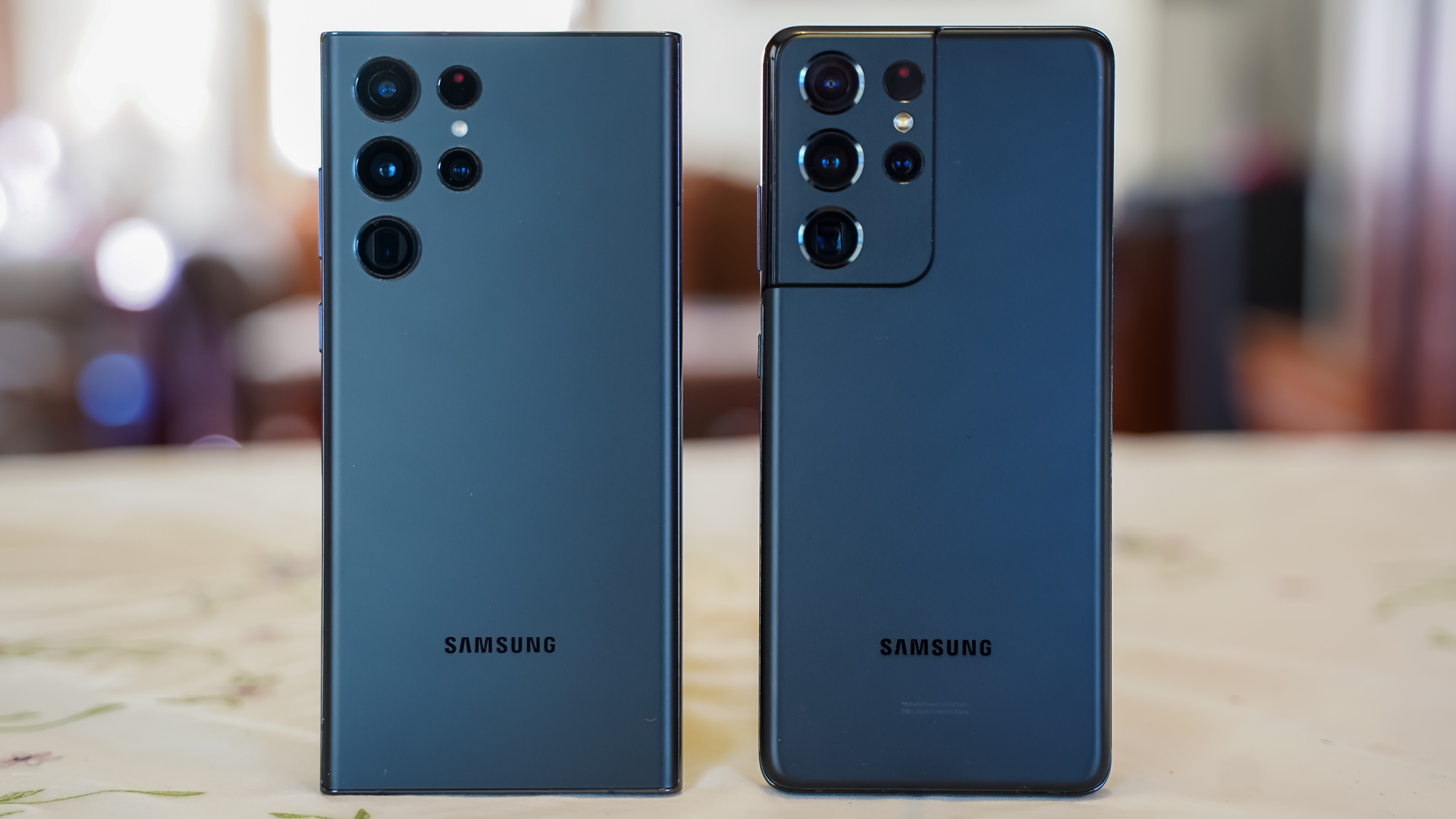 Samsung Galaxy S22 Ultra black vs Samsung Galaxy S21 Ultra black rear on table