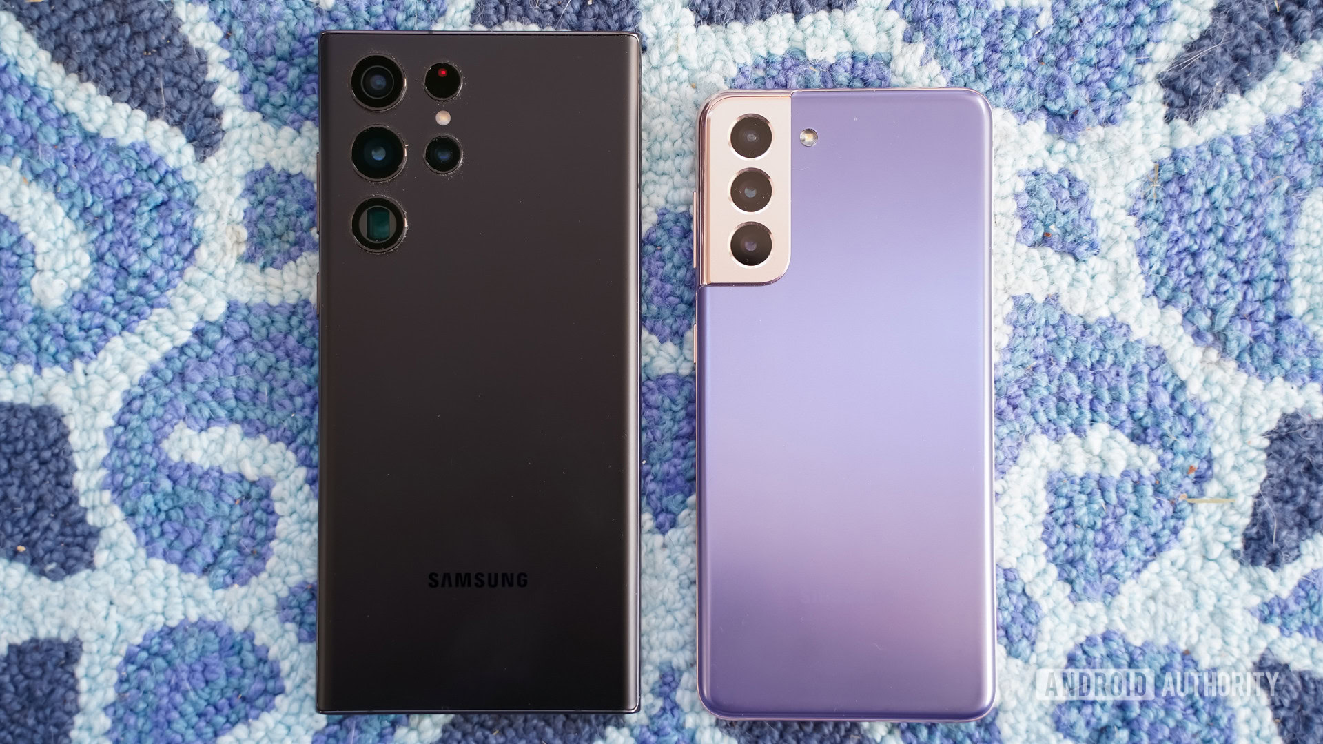 Samsung Galaxy S22 Ultra black vs Samsung Galaxy S21 purple rear on carpet