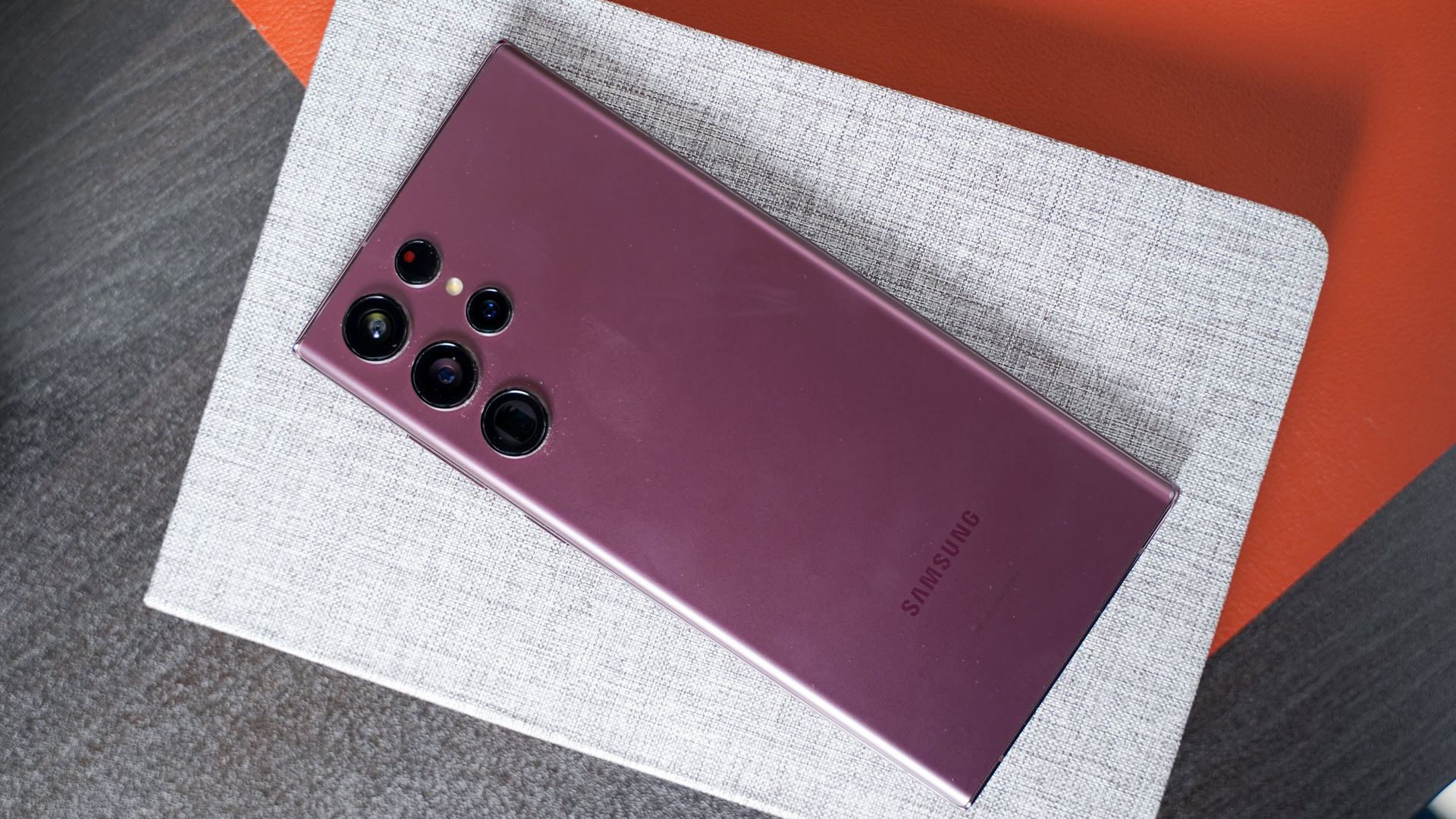 Samsung Galaxy S22 Ultra in lavendar on book