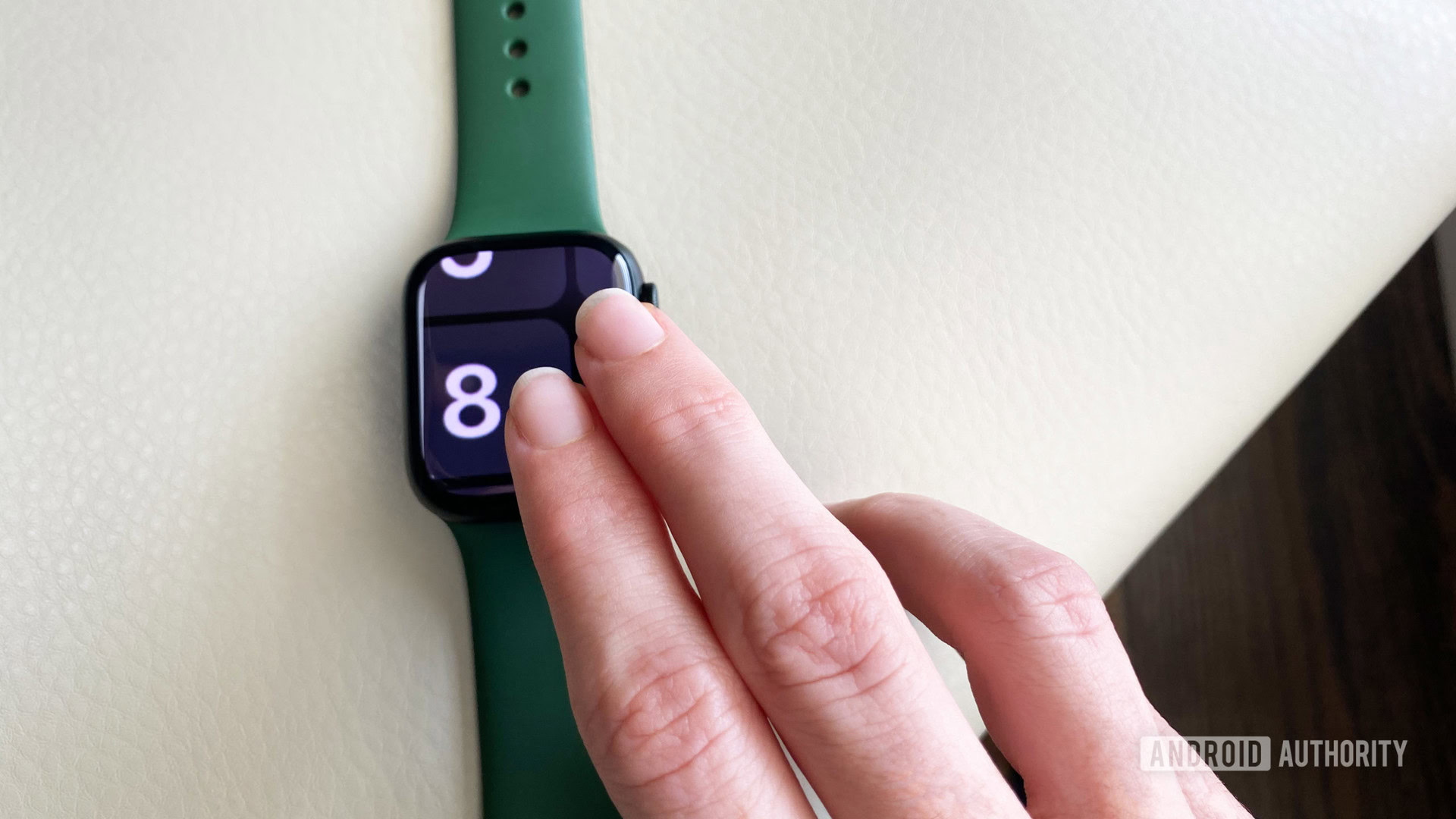A user zooms out the display on their Apple Watch Series 7 by double-tapping with two fingers.