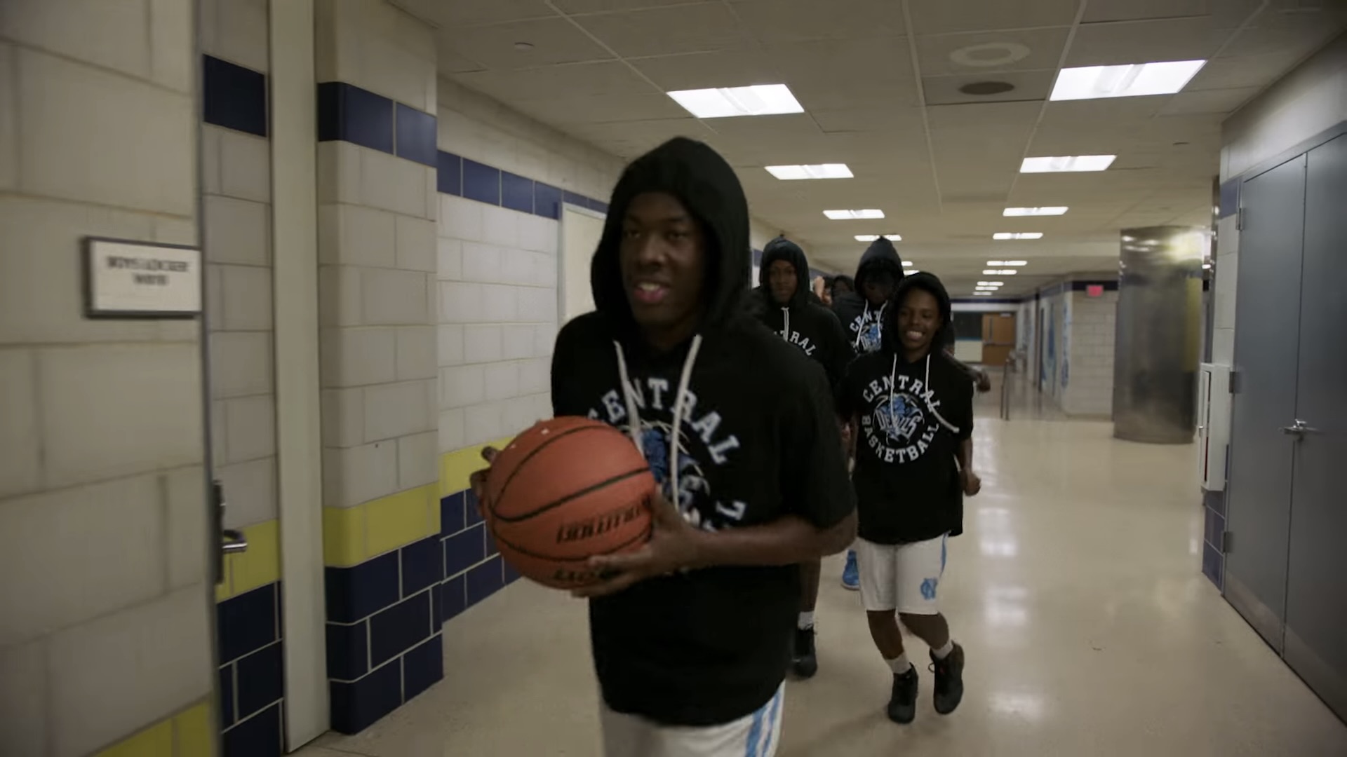 Basketball players walk down a hallway in Best Shot - best youtube originals