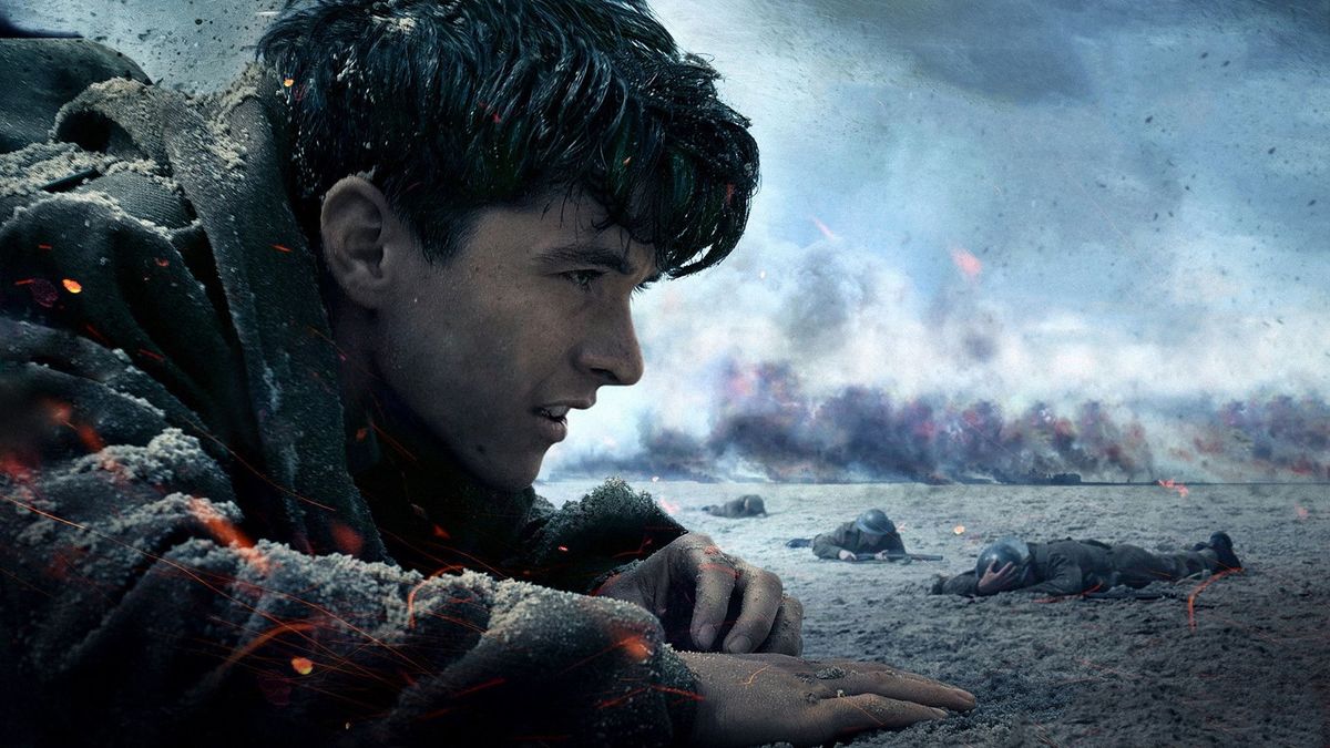 A soldier lies on his stomach on the beach in Dunkirk - best new streaming moves