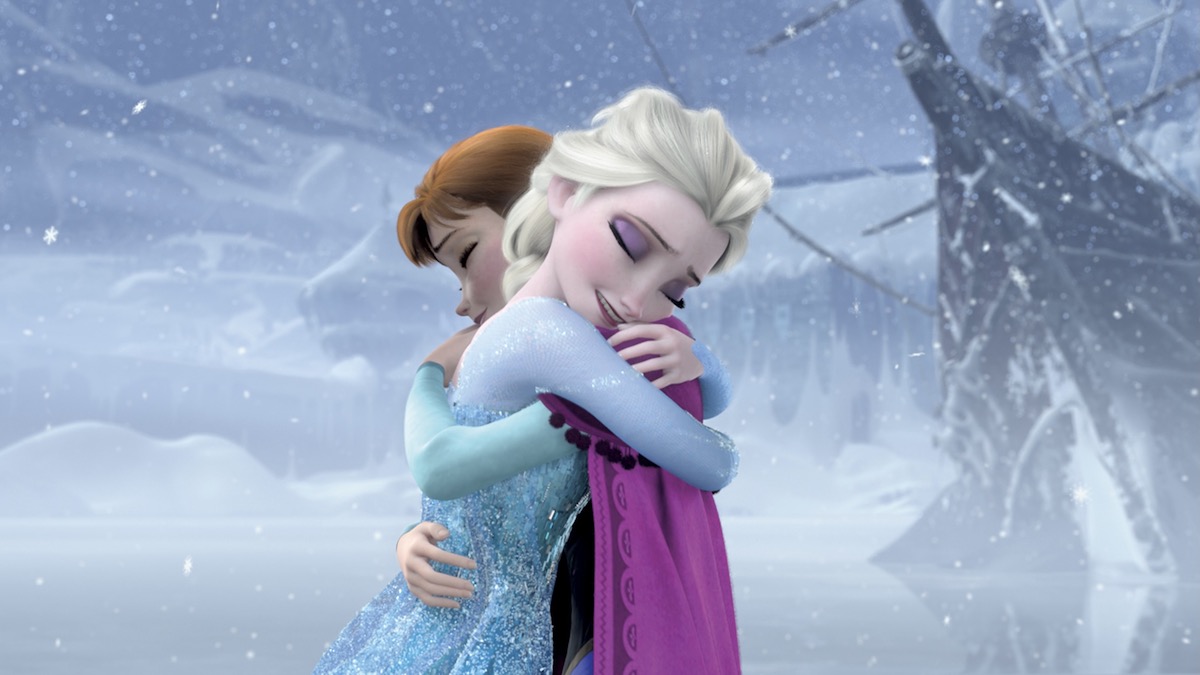 Elsa and Anna hug each other in Frozen - best family movies on disney plus