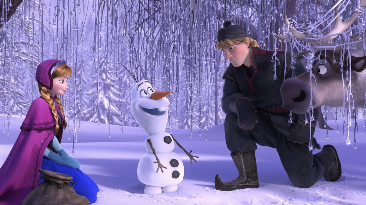 Anna, Kristoff, and Olaf stand in the snow in Frozen - best family movies on disney plus
