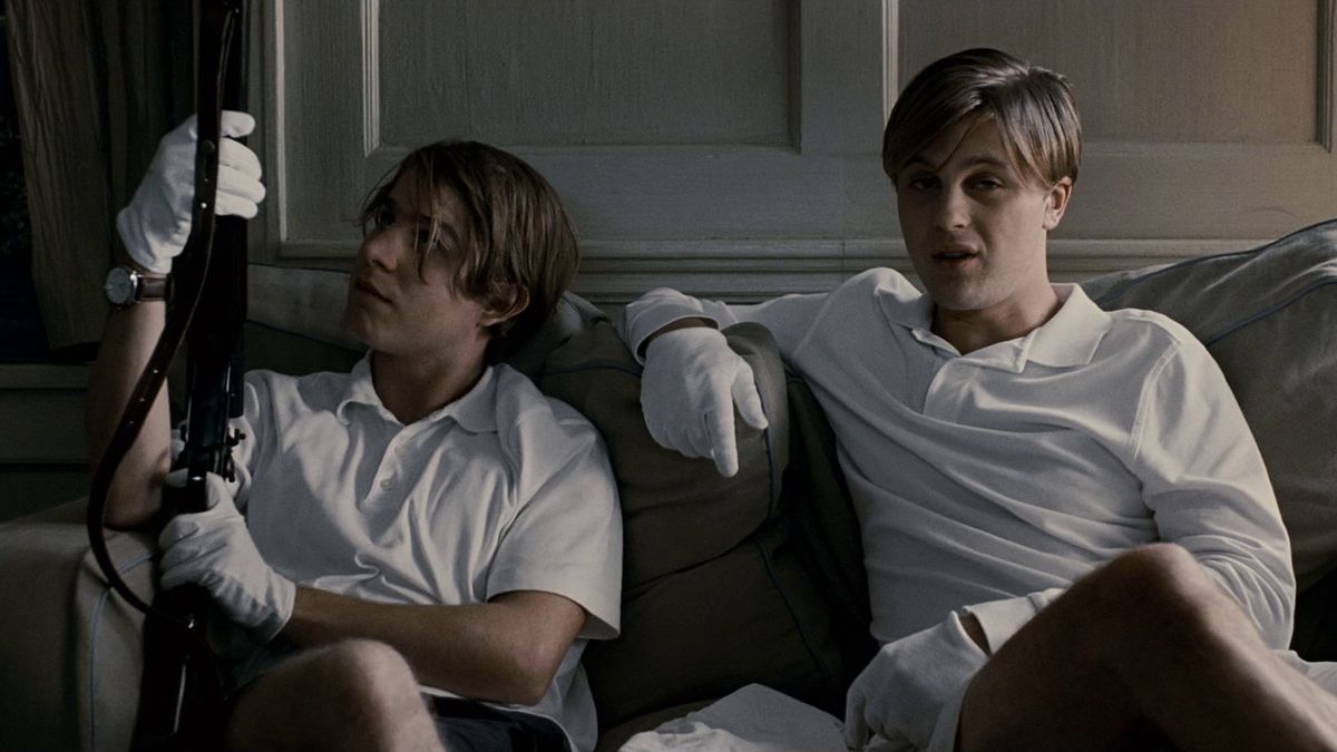 Michael Pitt and Brady Corbet sit on a couch in Funny Games - best english language remakes