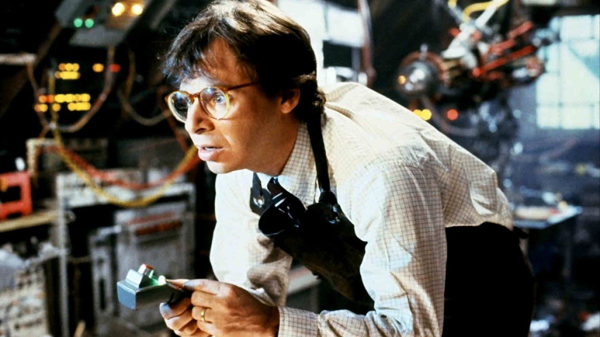 Rick moranis surrounded by gadgets in his workshop in honey i shrunk the kids - best family movies on disney plus