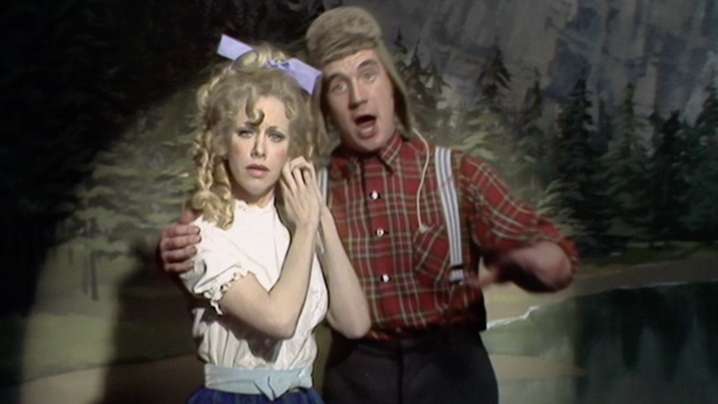 Michael Palin as a lumberjack with Carol Cleveland in Monty Pythons Flying Circus best british shows on Netflix
