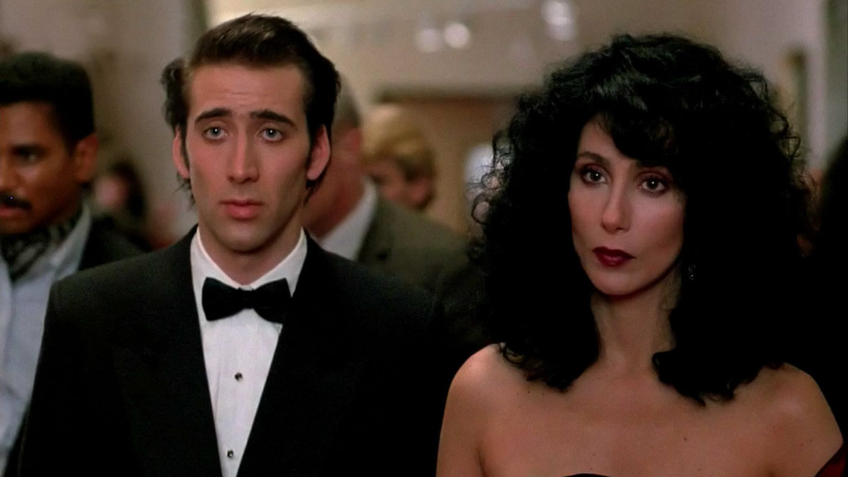 Nicolas Cage and Cher in formal wear in Moonstruck - best movies leaving streaming services in April