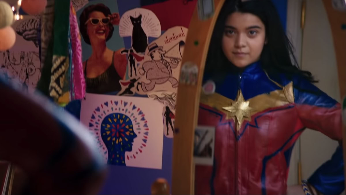 Kamala Kahn looks at herself in the mirror while wearing a Captain Marvel costume - Ms. Marvel trailer breakdown