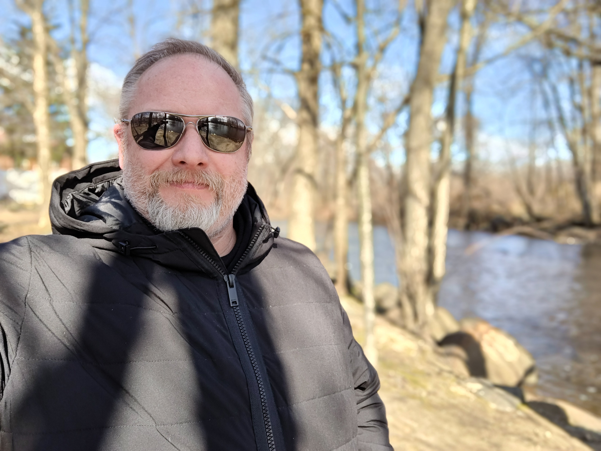 OnePlus 10 Pro self portrait of a man wearing a jacket and shades, outside