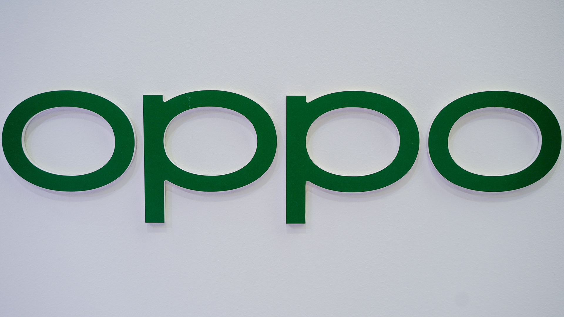 OPPO logo in green on white MWC 2022
