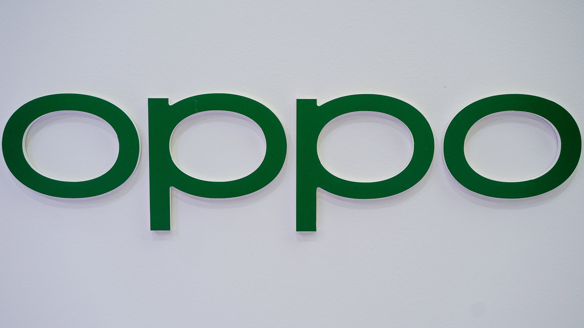 OPPO logo in green on white MWC 2022