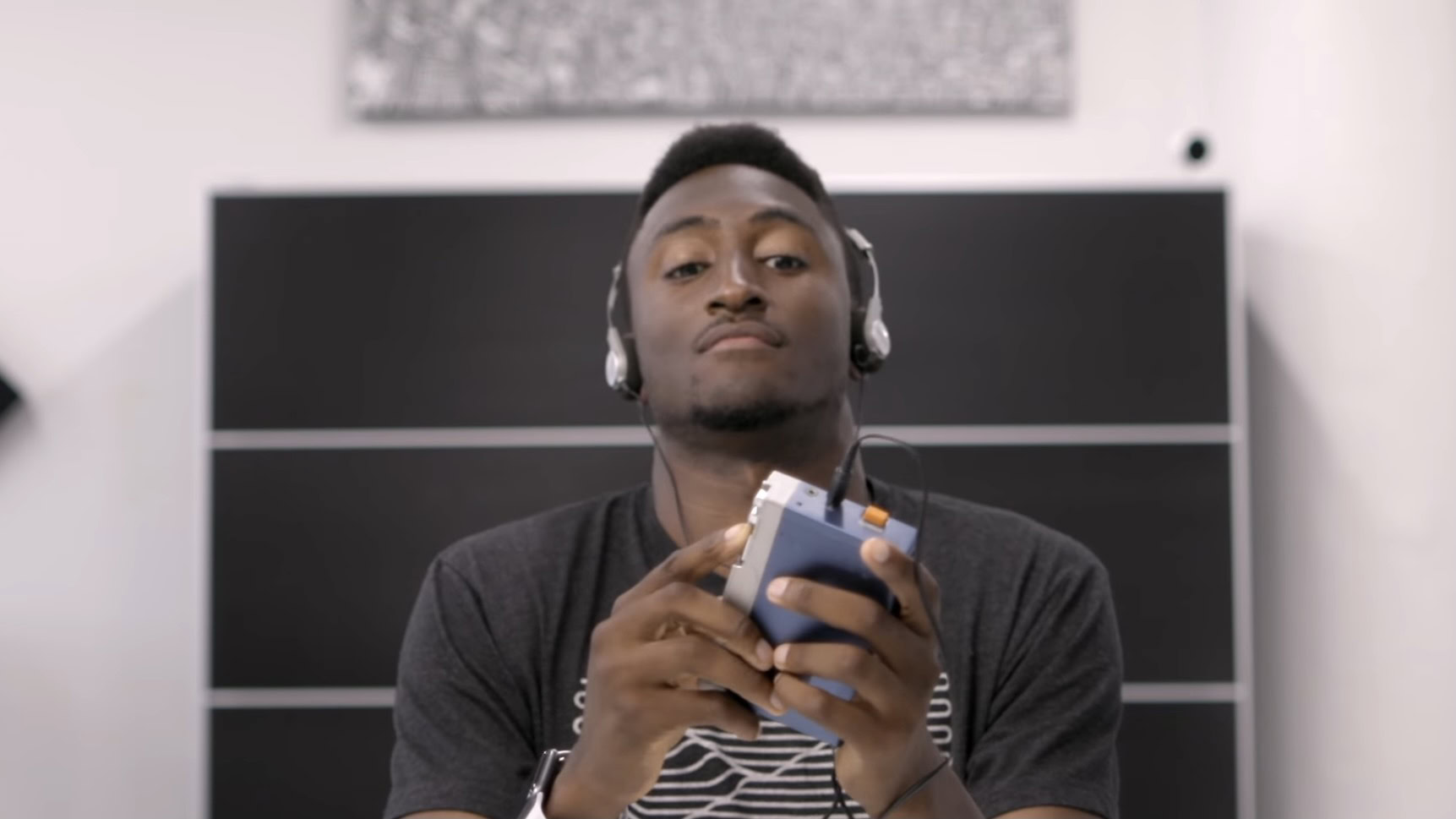 Marques Brownlee holds an old Walkman in Retro Tech