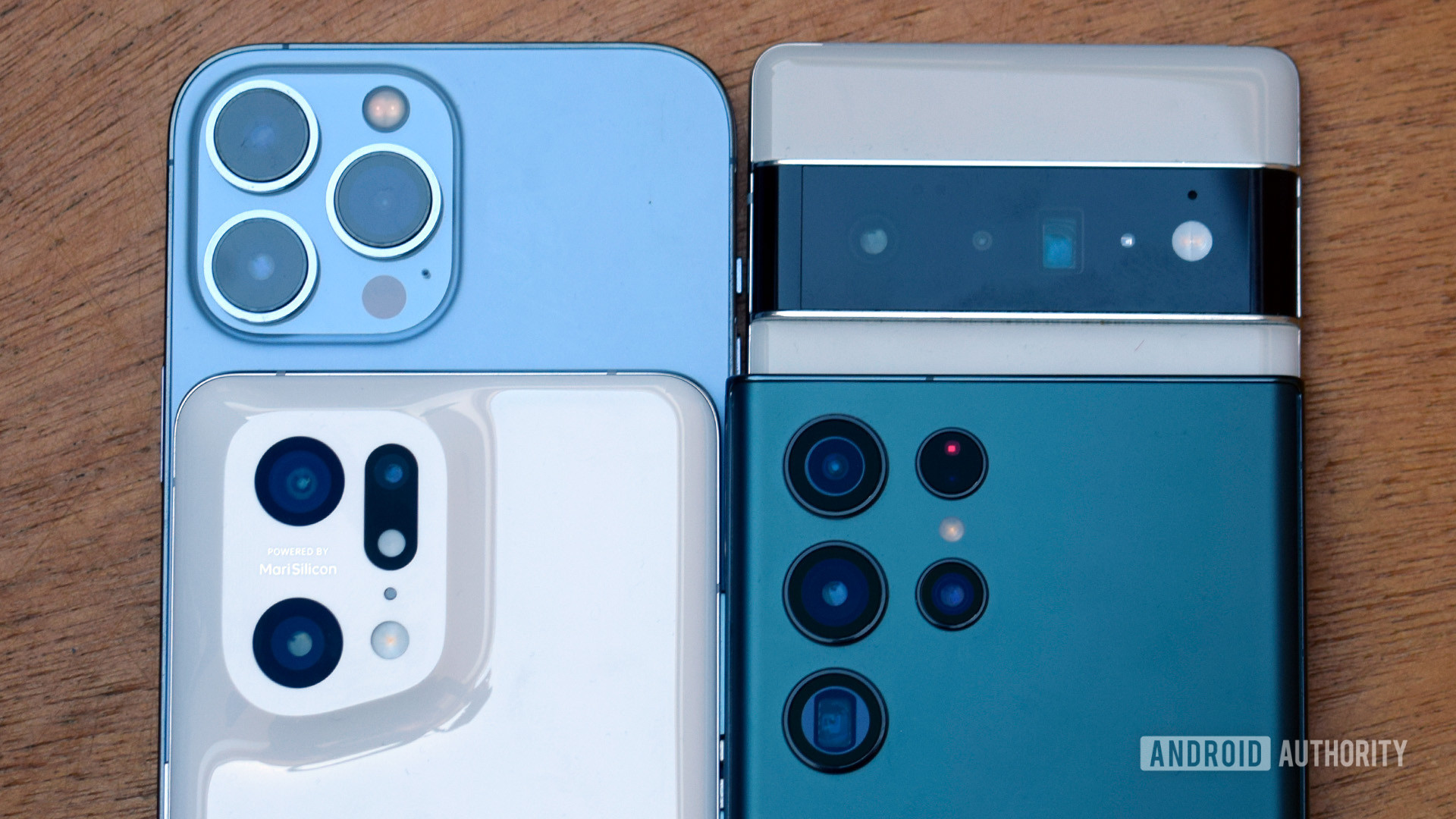 Samsung Galaxy S22 Ultra, Pixel 6 Pro, OPPO Find X5 Pro, and iPhone 13 Pro Max camera housings close up