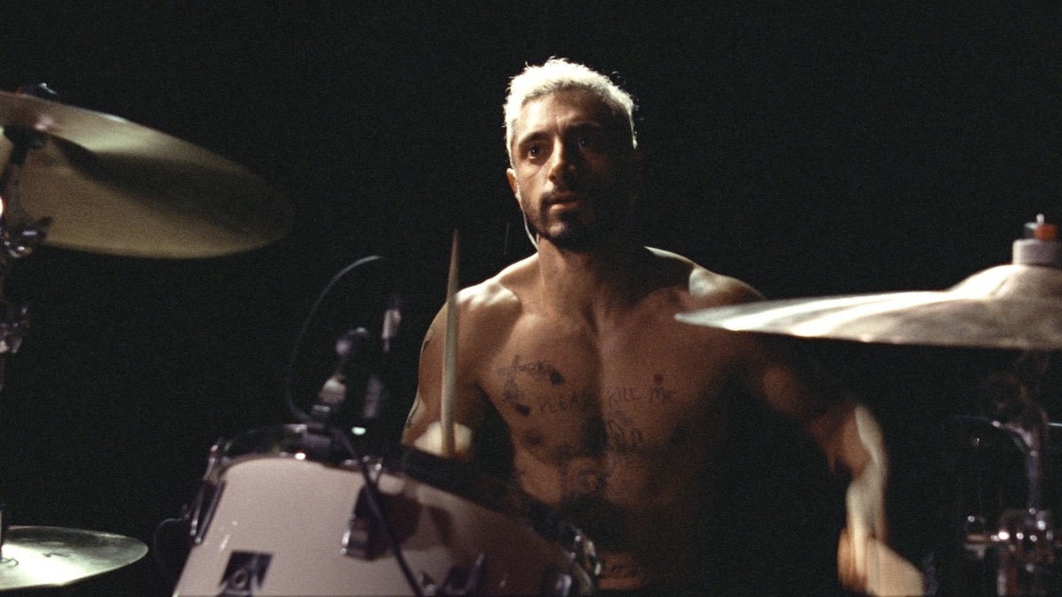 Riz Ahmed sits at drums in Sound of Metal