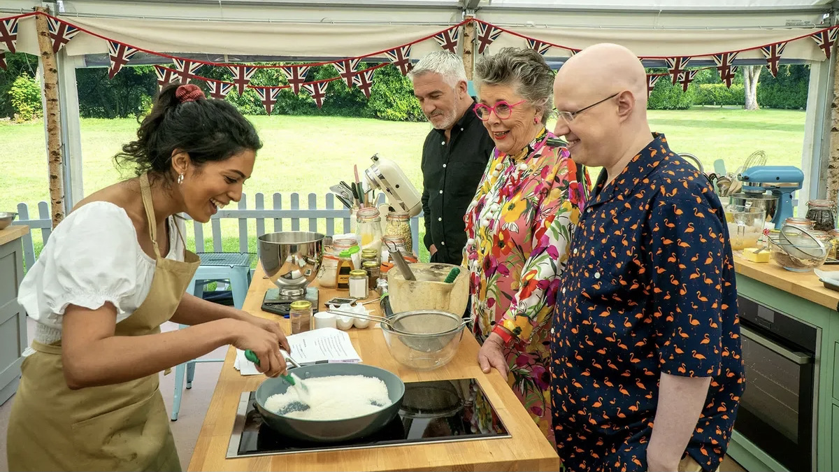 The judges of The Great British Baking Show try a dish