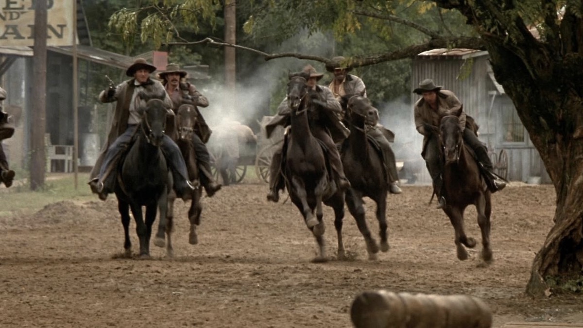 Cowboys on horseback in The Long Riders - best westerns on netflix