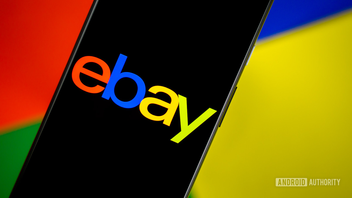 The word &quot;eBay&quot; superimposed on a smartphone in front a of background using the same colors as the ebay logo.