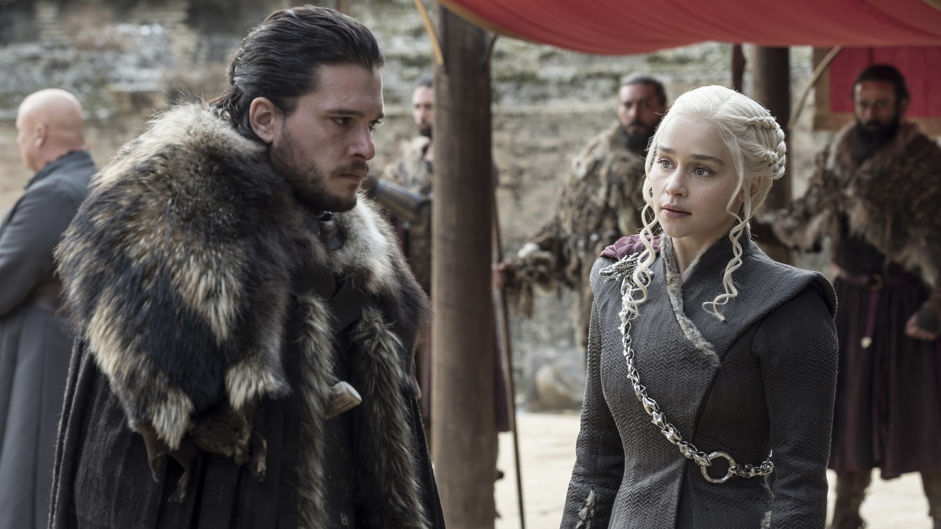 Kit Harington and Emilia Clarke confer in Game of Thrones - shows like the last kingdom