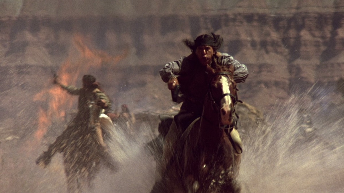 A man rides on horseback in Geronimo - best westerns on netflix