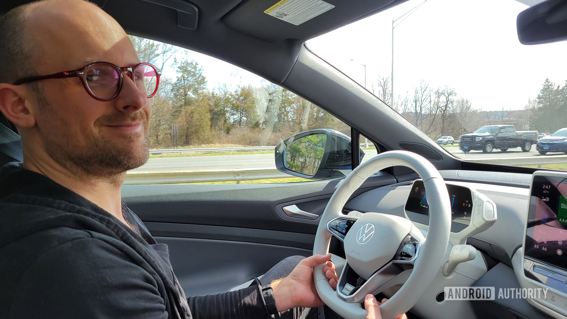 Man wearing glasses at the wheel of a car — Road Trip Tech 2022
