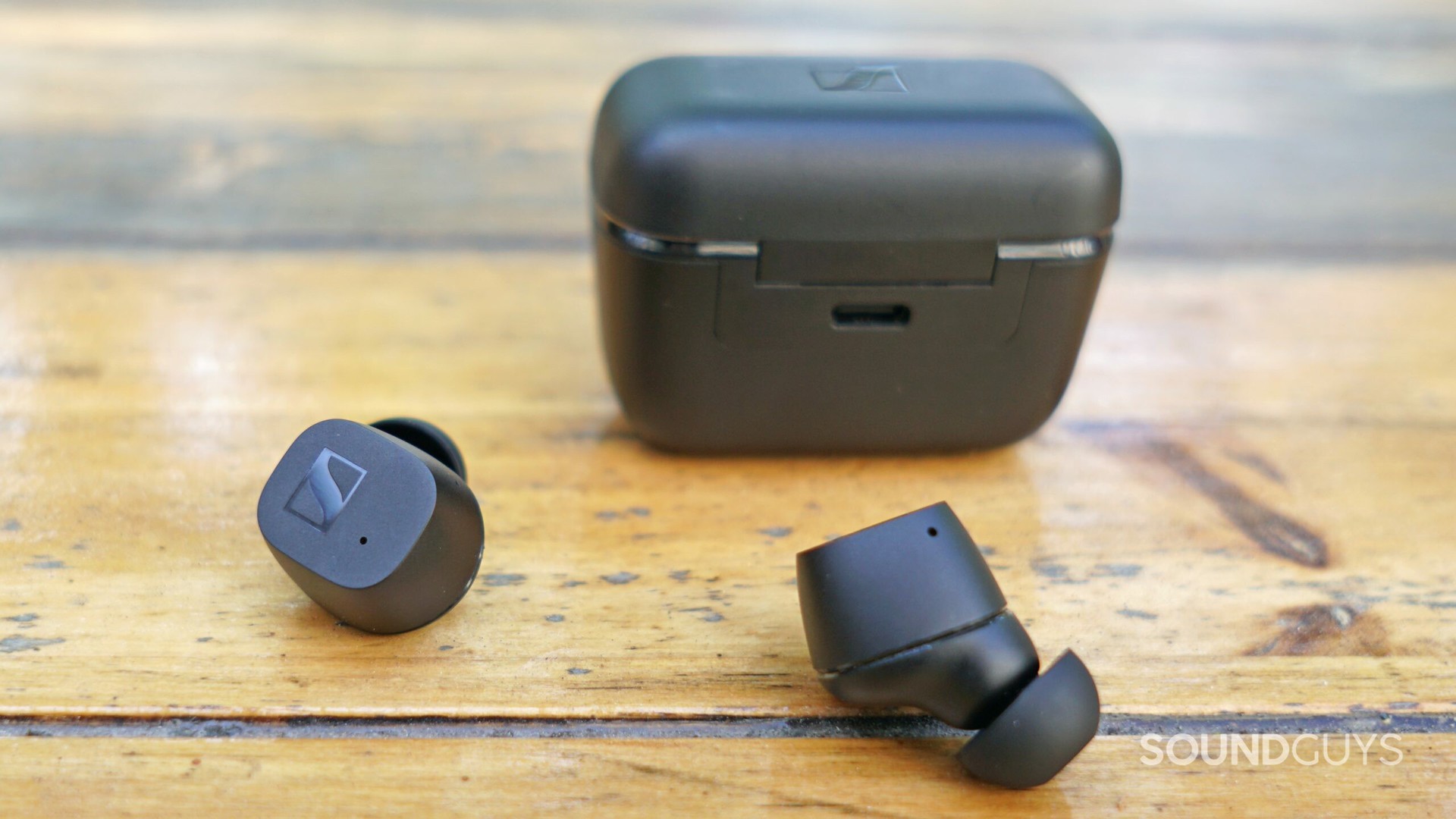 Sennheiser CX True Wireless Earbuds case and earbuds, displaying the charging port on the back of the case.