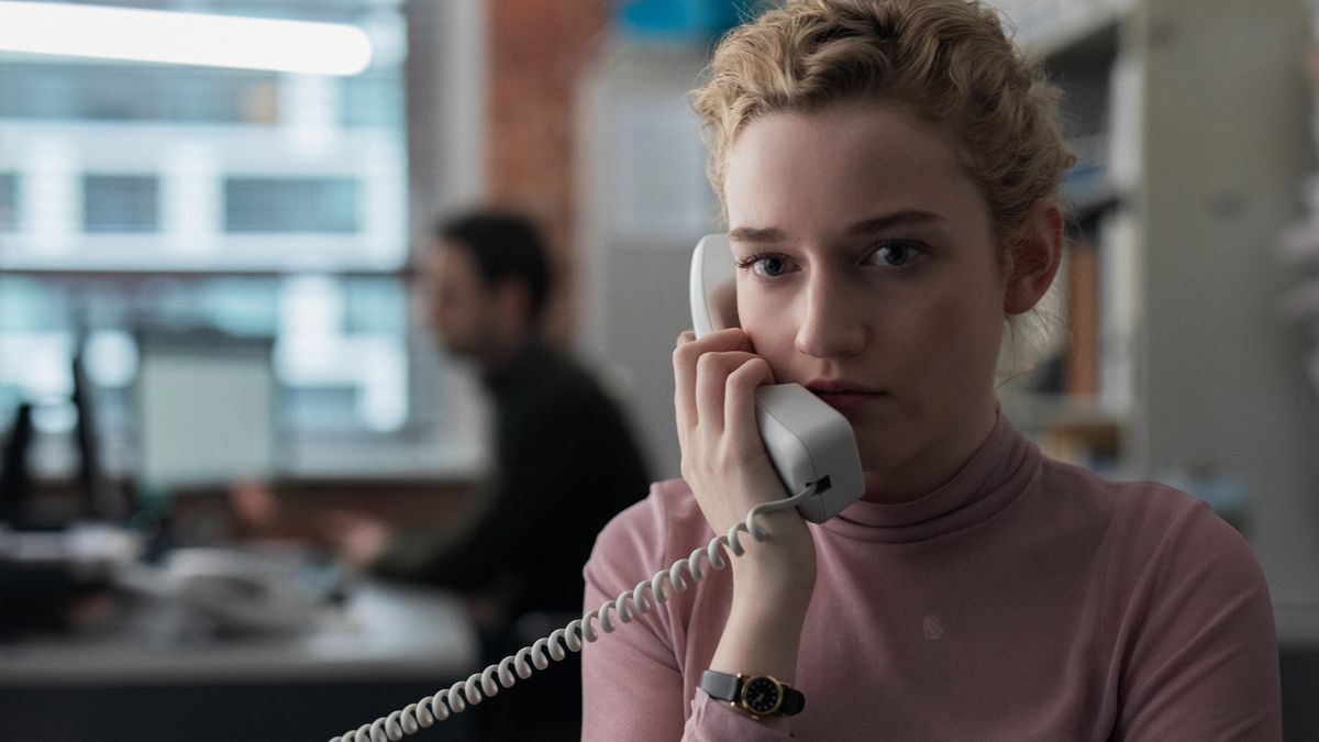 Julia Garner on the phone in The Assistant - best underrated movies to stream