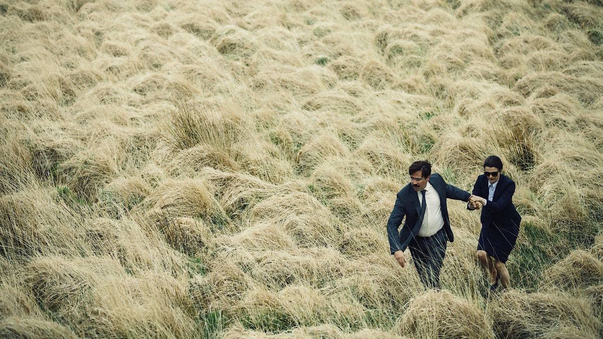 Colin Farrell and Rachel Weisz running through a wheat field in The Lobster