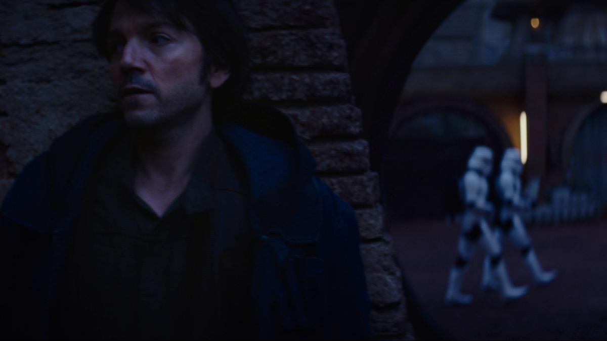 Diego Luna as Andor, hiding from stormtroopers