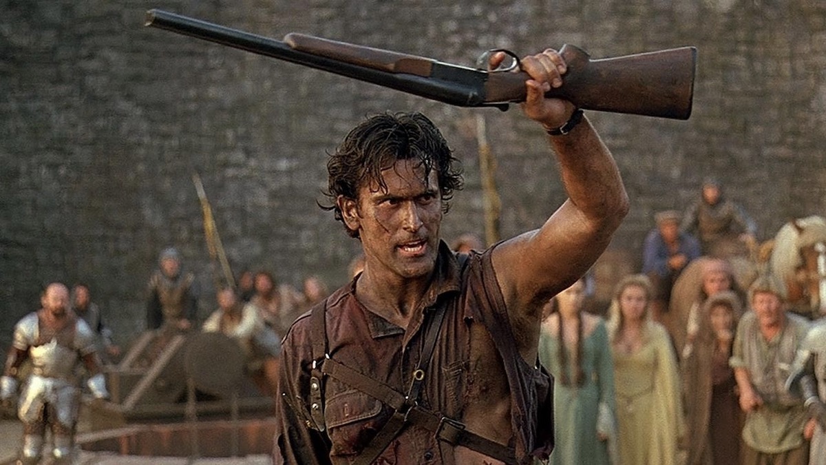 Bruce Campbell holds up a rifle in Army of Darkness