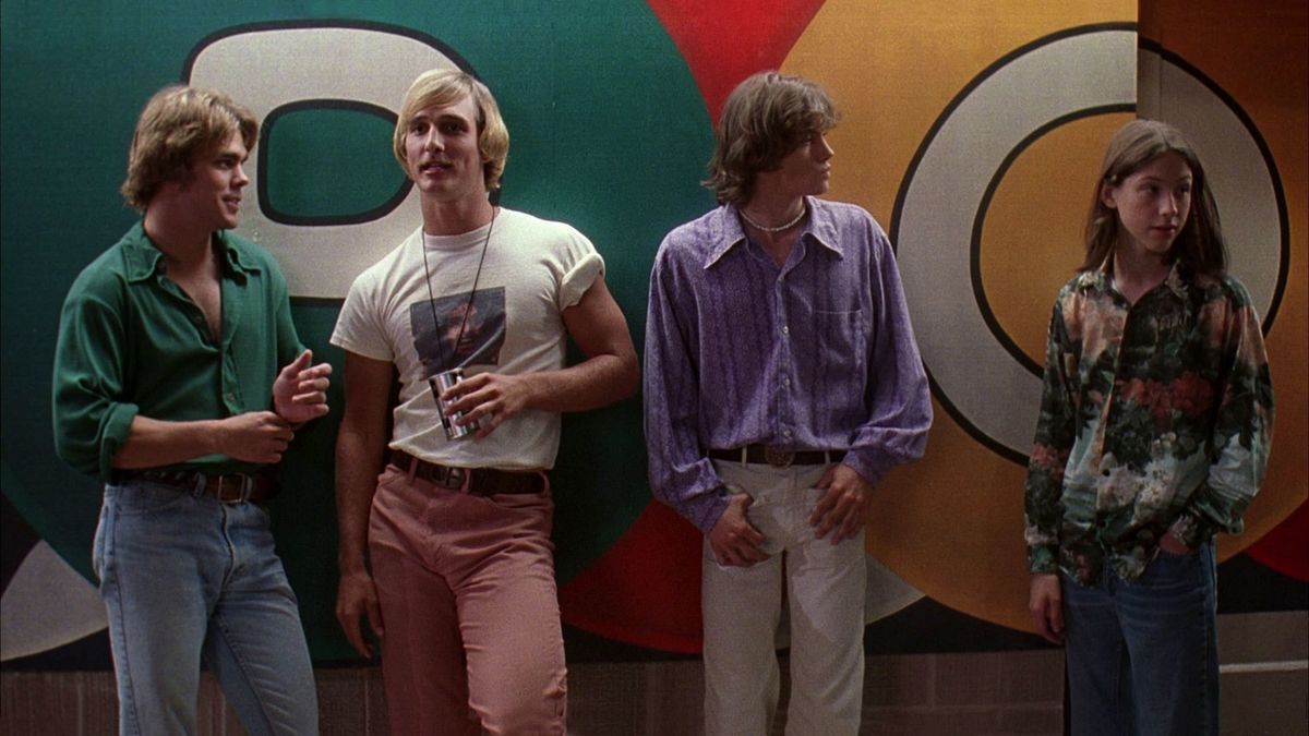 Four teens leaning against a wall in Dazed and Confused - best peacock movies