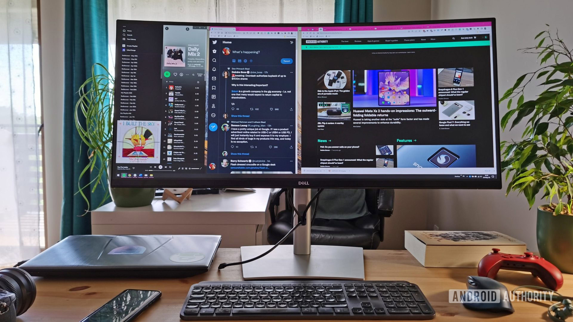 Dell P3421W ultrawide monitor and keyboard.