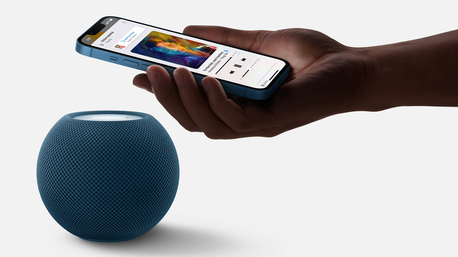 Handoff between an iPhone and a blue HomePod Mini set up