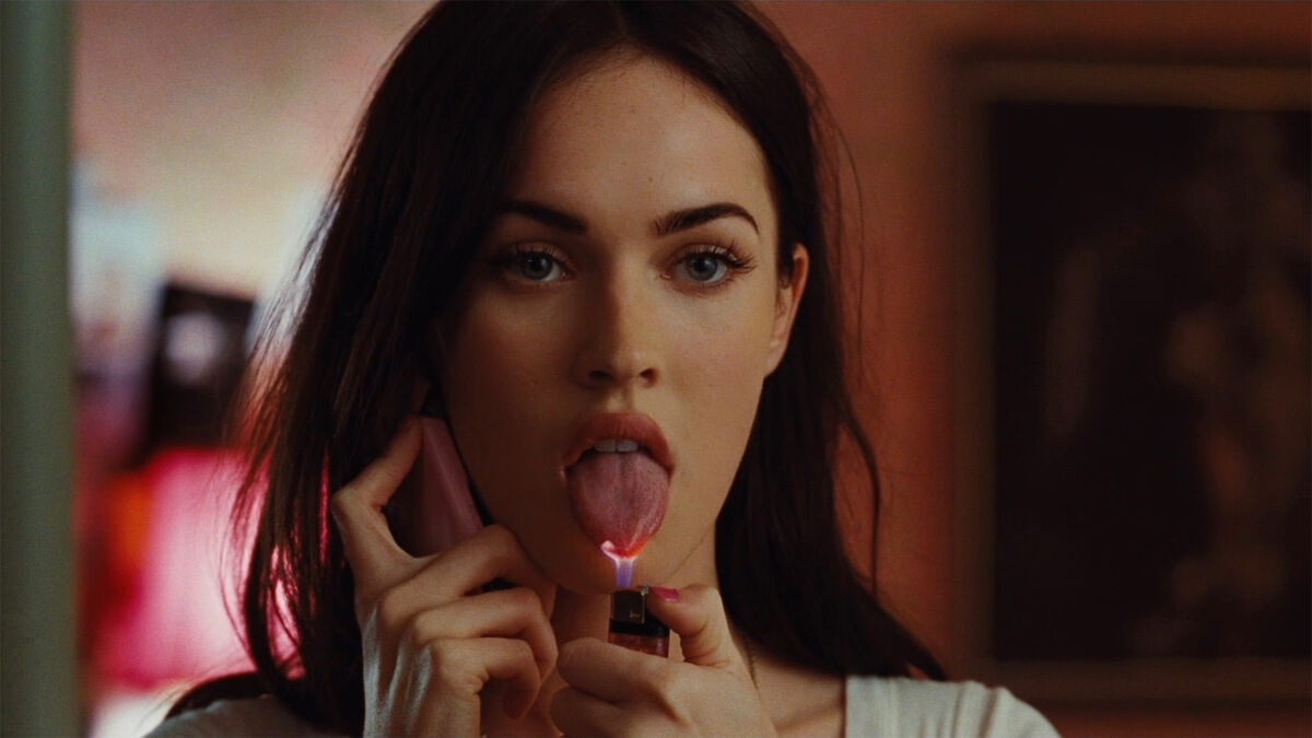 Megan Fox holds a lighter to her tongue in Jennifers Body - disney plus revivals