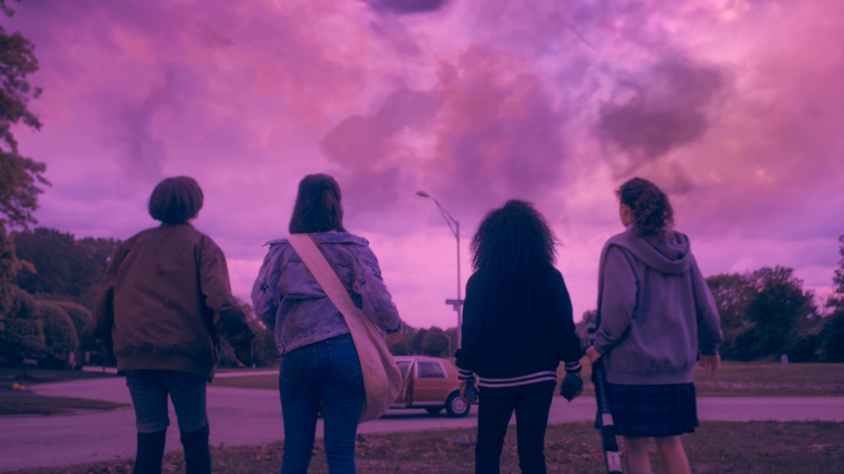 four girls looking at a bright pink sky in Paper Girls - new on amazon prime video in July