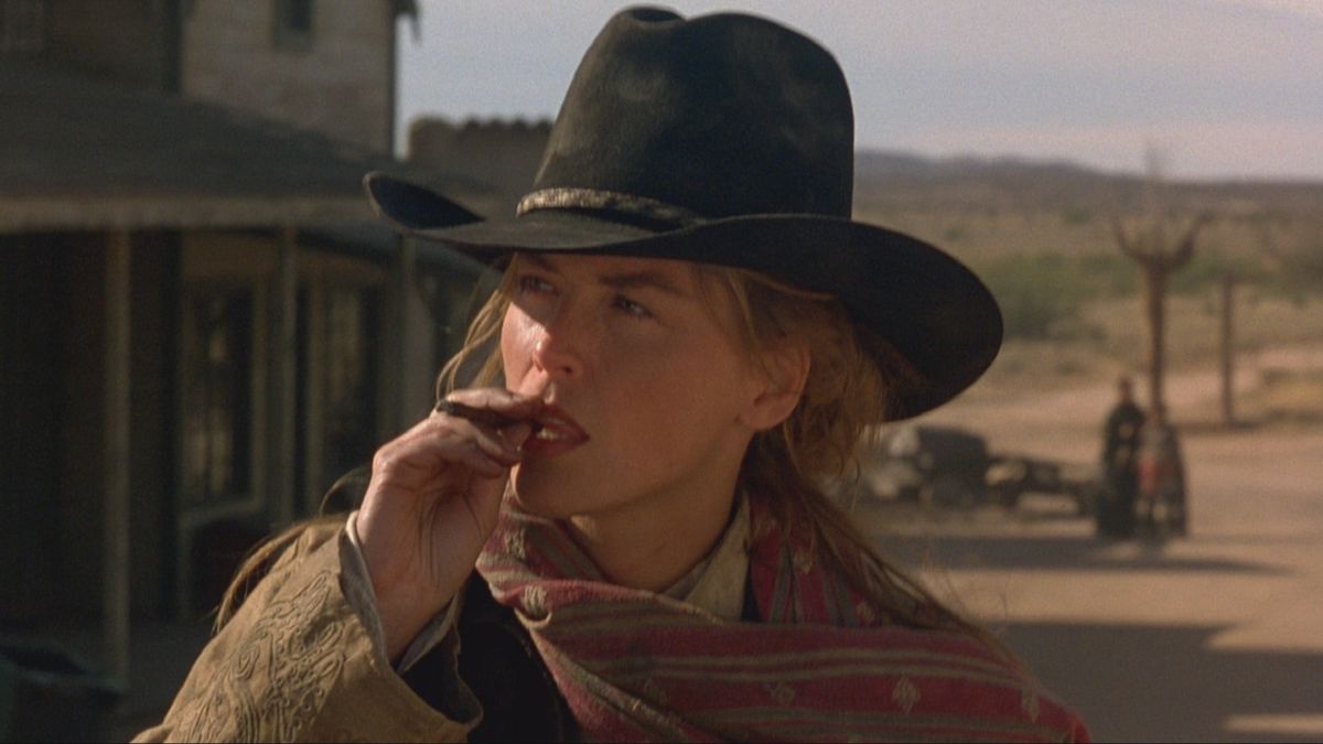 Sharon Stone smokes a cigar in The Quick and the Dead - best sam raimi movies ranked